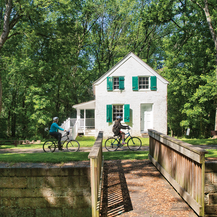 cyclists biking in front of lockhouse 28