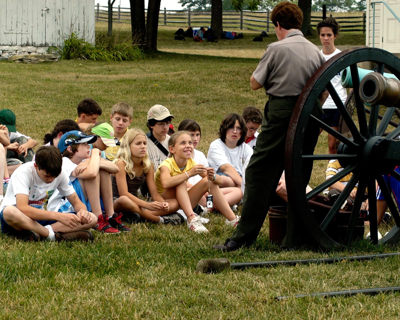 students seated, learning from a park ranger
