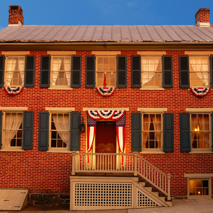 exterior of the brick building shriver house museum at sunset